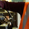 worker using digital tablet to control machinery