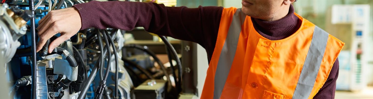 worker using digital tablet to control machinery